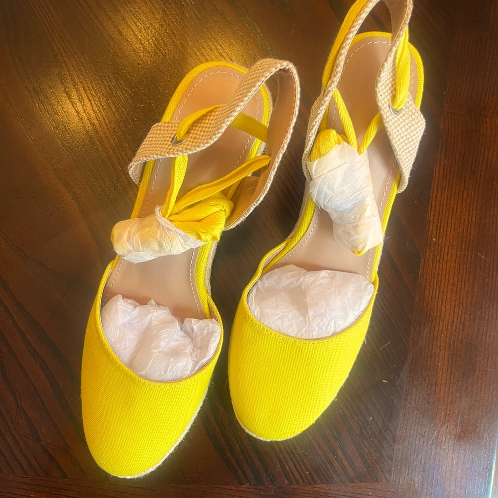Adorable bright yellow lace up espadrilles. Size 9.5 Brand new, never worn